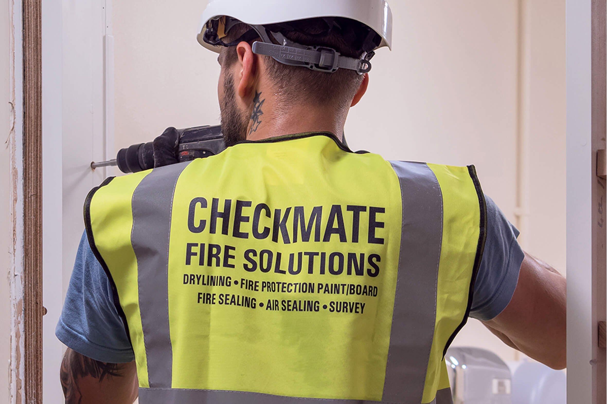 Checkmate engineer remediating a fire door